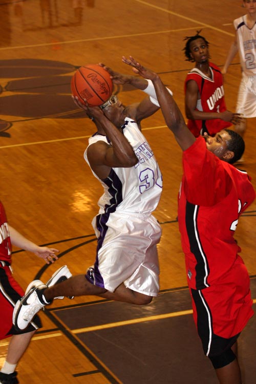 Bethel's Leon Sewell skies to the bucket against #22 Union University. He had 13 points, 6 boards, 3 blocks and 1 steal